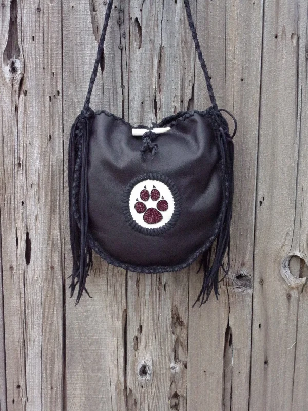 Chic Style, Always In Vogue Black leather tote with wolf paw totem