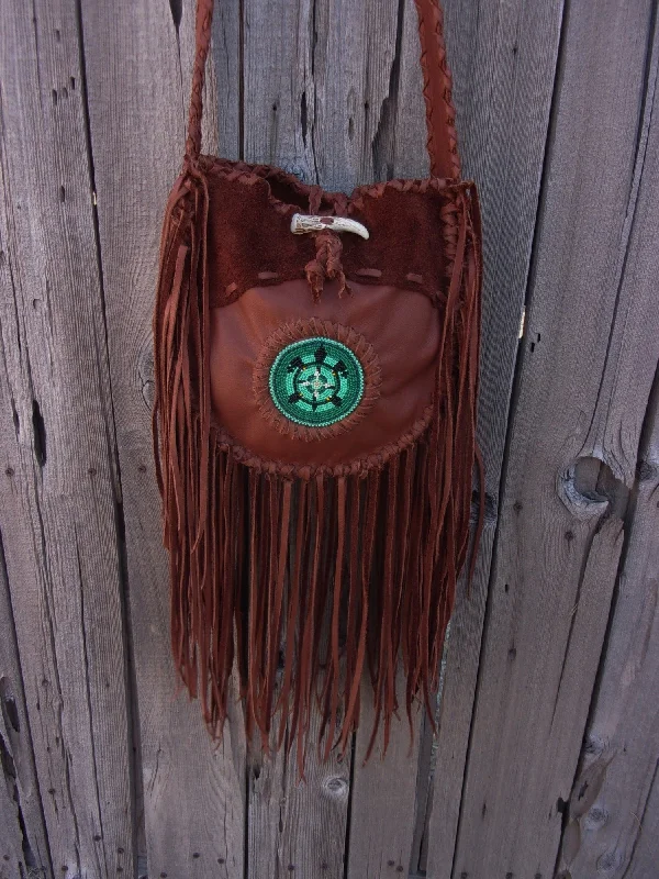 The Latest Trends Fringed leather tote with beaded turtle