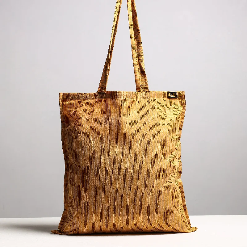 Compact Bags For Minimalist Travelers Brown - Handcrafted Pochampally Ikat Weave Cotton Jhola Bag Compact Bags For Minimalist Travelers Brown - Handcrafted Pochampally Ikat Weave Cotton Jhola Bag